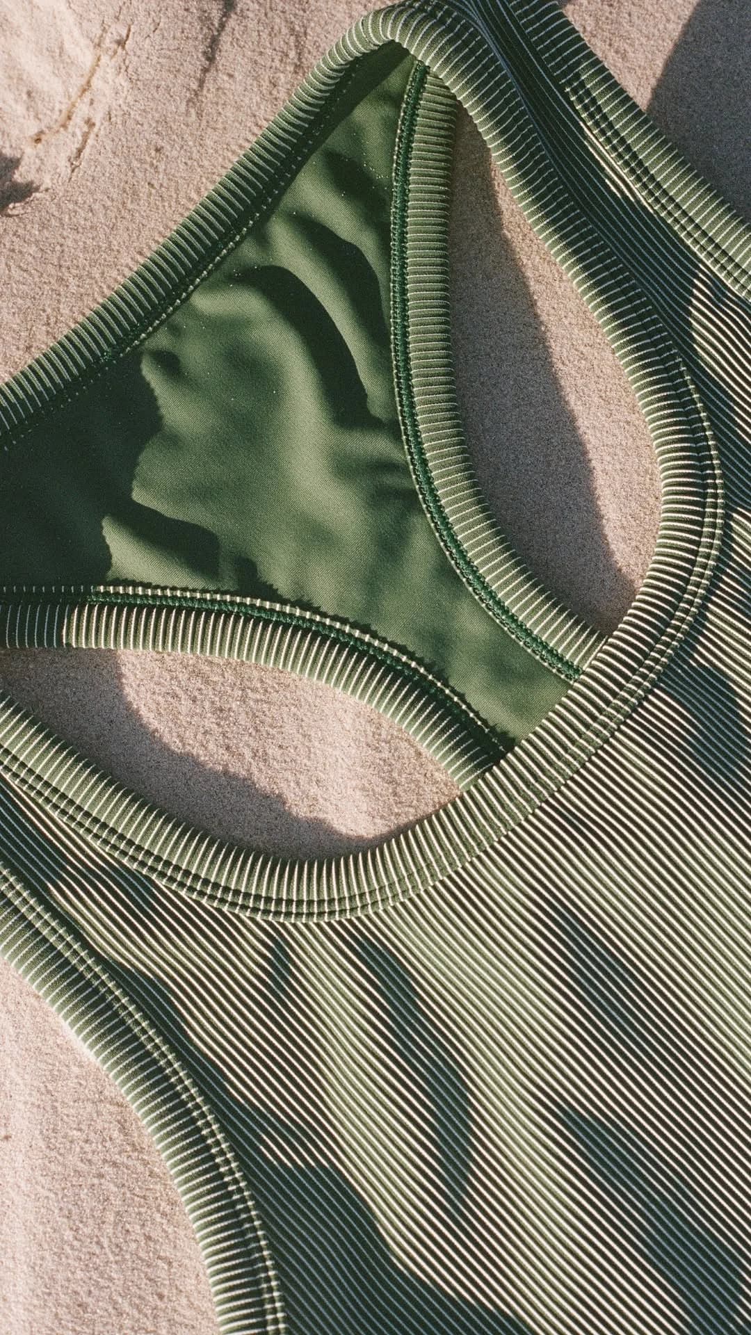 Green Ribbed Swimwear — Textured Flat Lay