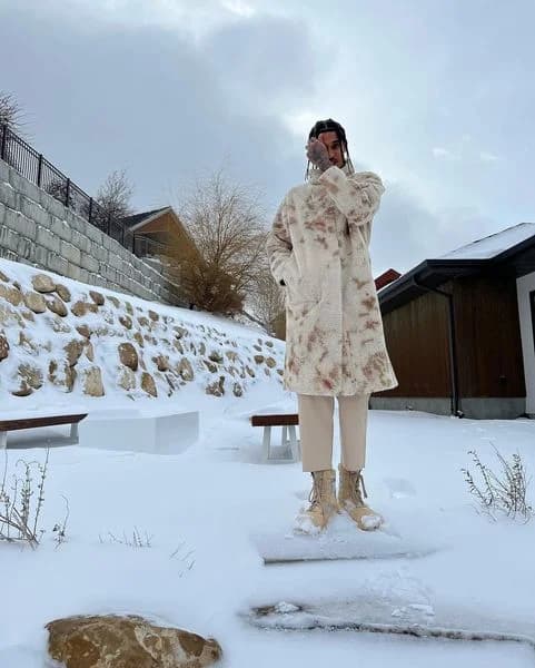 Fashion Coat & Boots — Snowy Lifestyle Shot