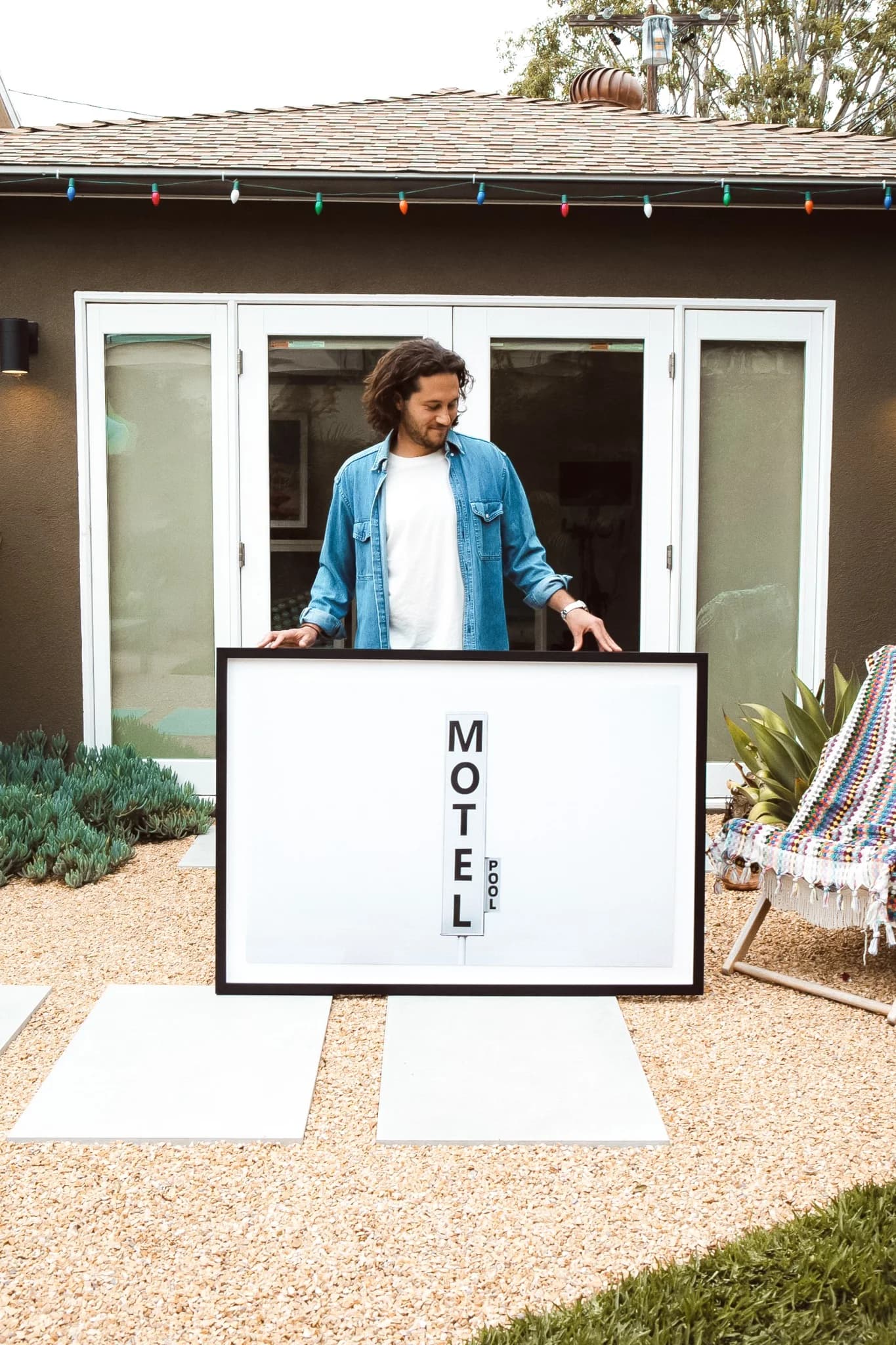 Man Holding 'Motel Pool' Print — Lifestyle Shot