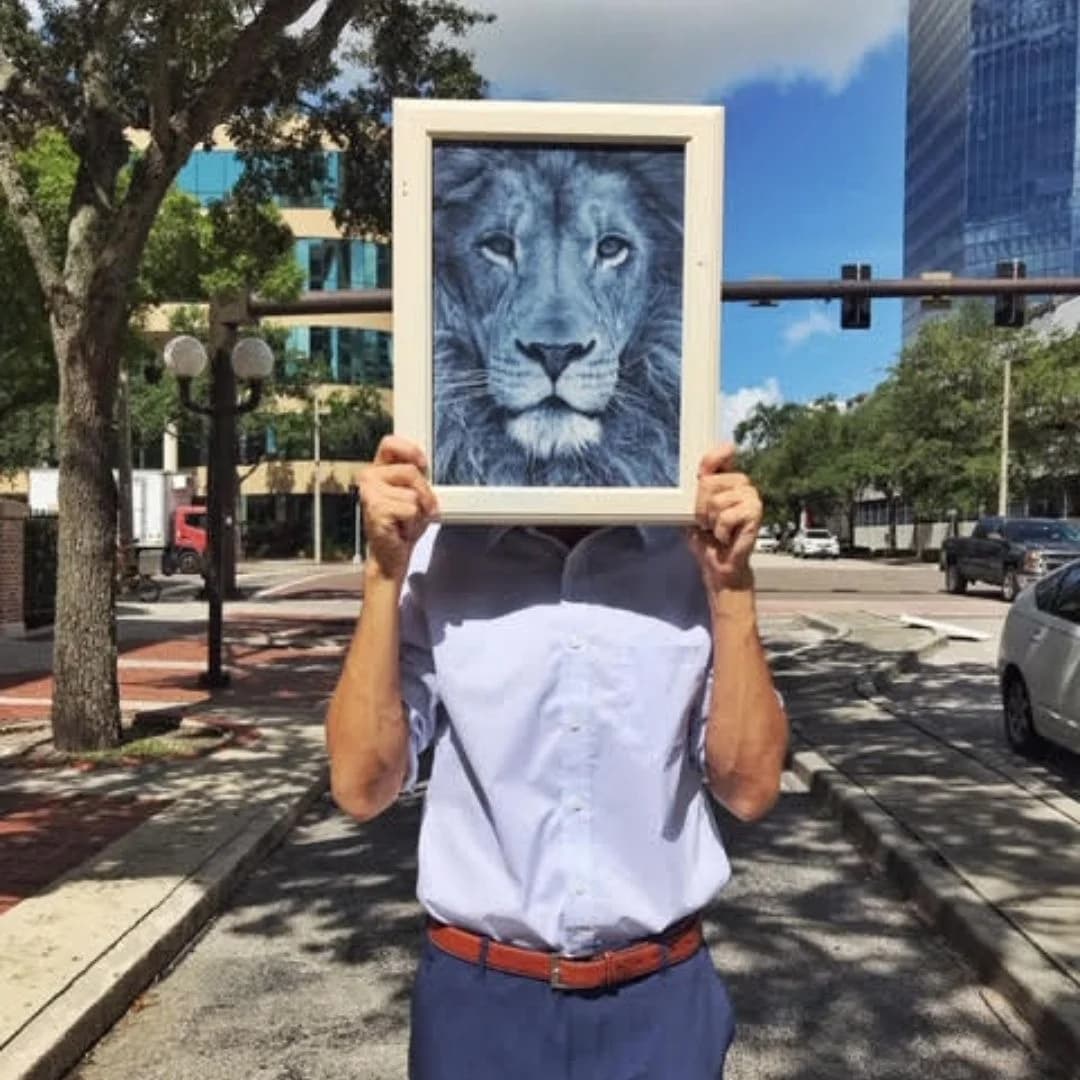 Man Holding Lion Portrait — Urban Street Scene