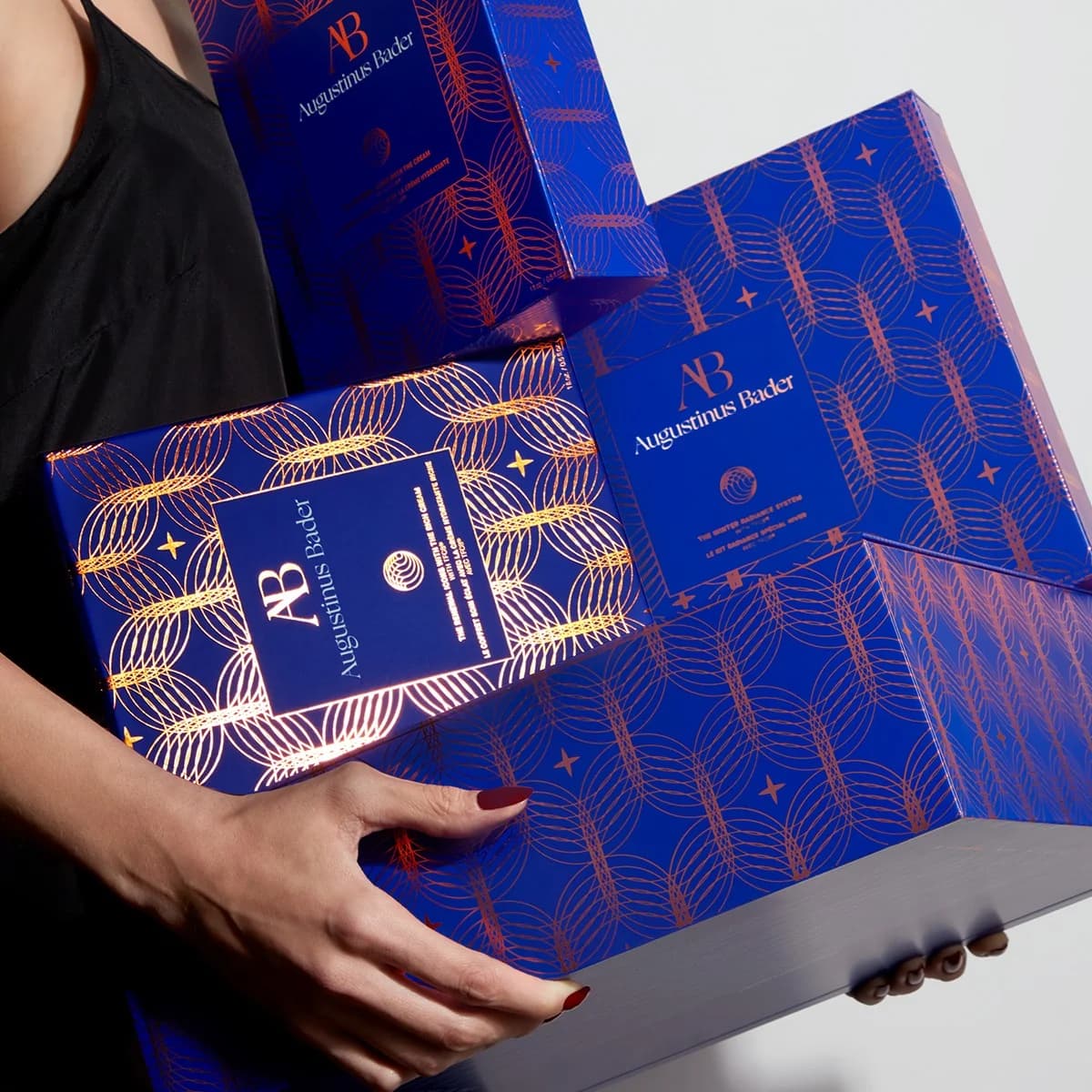 Augustinus Bader — Luxury Gift Box Stack - fashion ad example for Instagram
