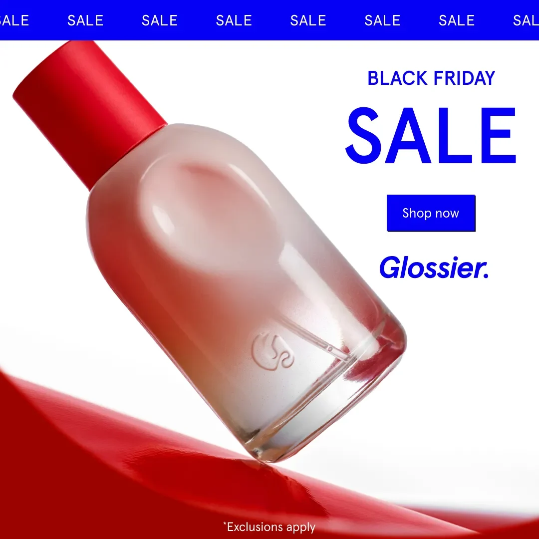Glossier Black Friday ad example: a tilted pink Glossier You perfume bottle on a red swoosh, blue SALE headline and a sale ticker
