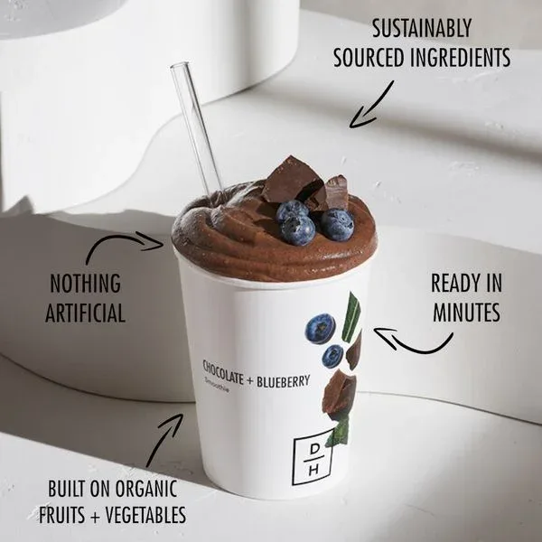 Daily Harvest food ad example: a chocolate blueberry smoothie cup with four handwritten benefit callouts and arrows