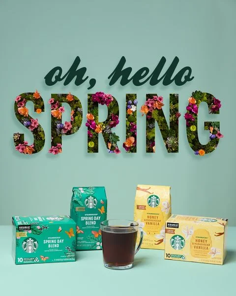 Starbucks spring flat lay static ad with floral "Spring" lettering on a mint background