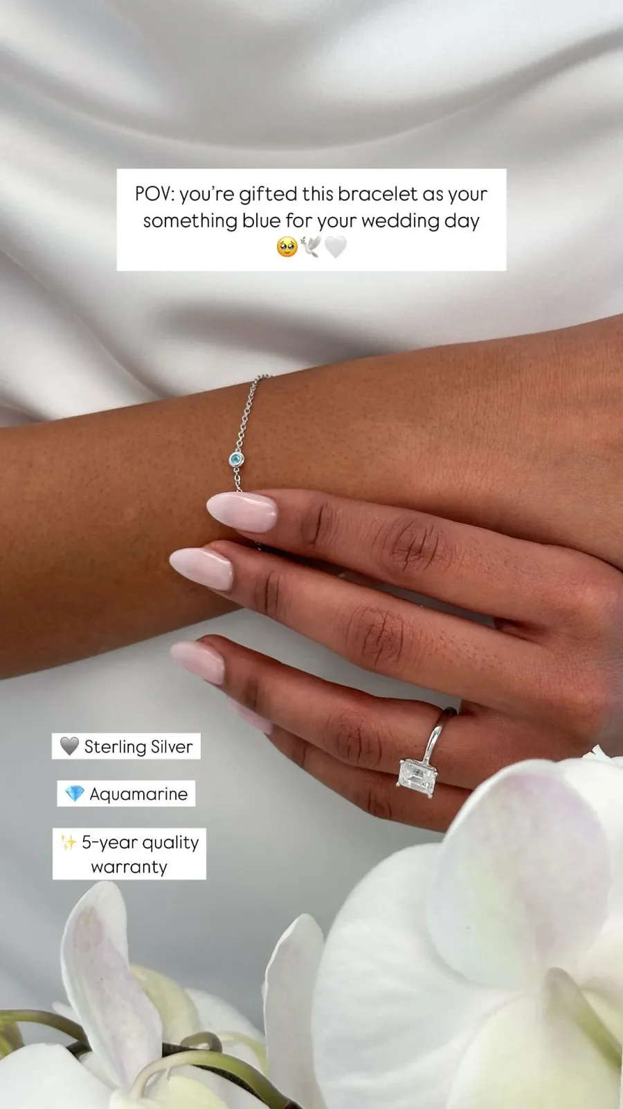 Abbott Lyon bracelet ad: a bride's wrist in white satin wearing a fine silver bracelet with an aquamarine, "POV: you're gifted this bracelet as your something blue"