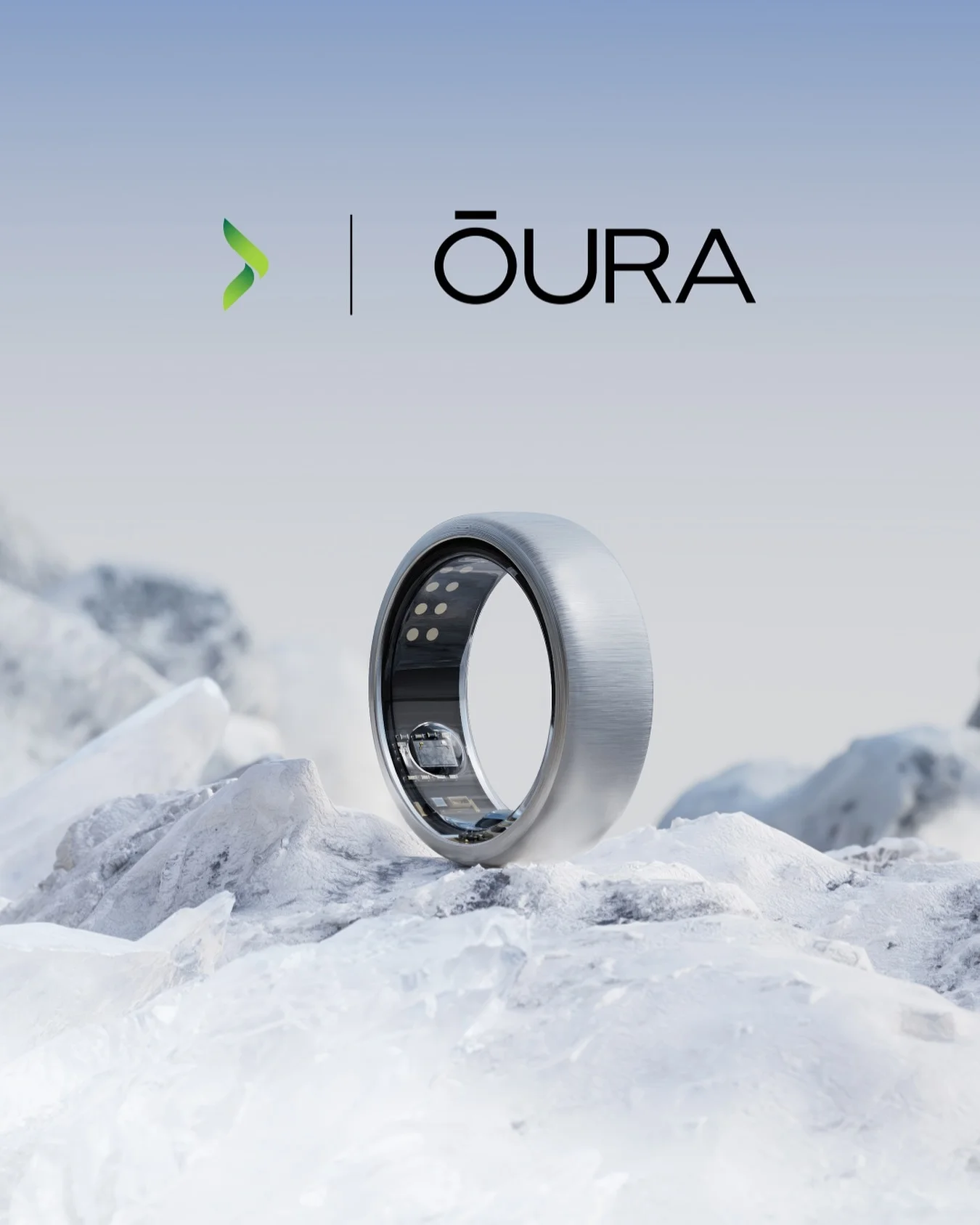 Oura luxury ad example: a brushed silver smart ring standing on a bed of ice under a pale blue sky