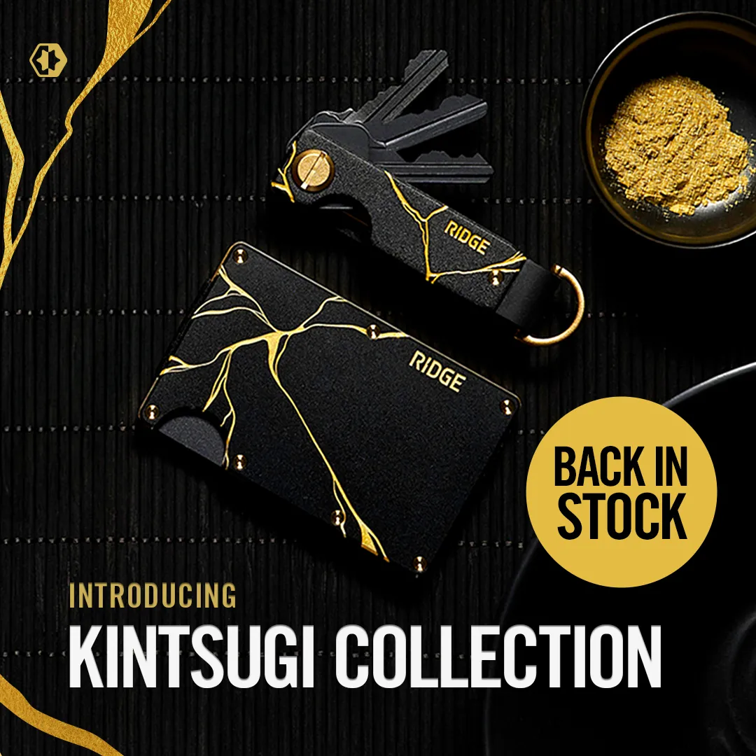 The Ridge luxury ad example: black aluminum wallet and key organizer with gold kintsugi cracks on a black bamboo mat