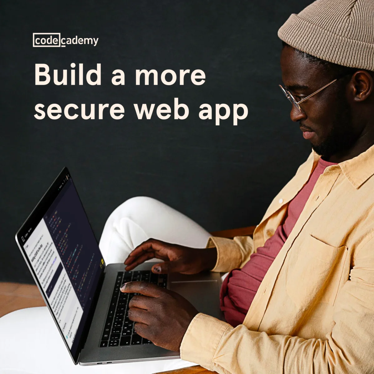 Codecademy Build a more secure web app ad showing a developer working on a laptop with the course open