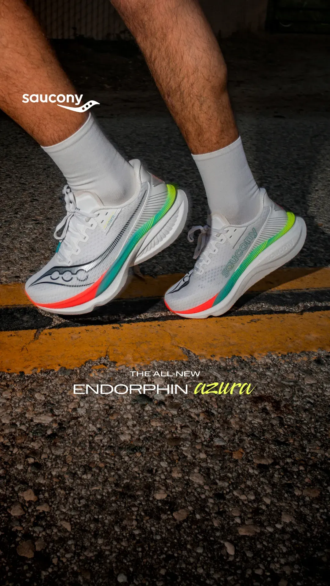 Saucony running shoe ad example: runner's feet in white and neon Endorphin shoes on asphalt with a yellow road line