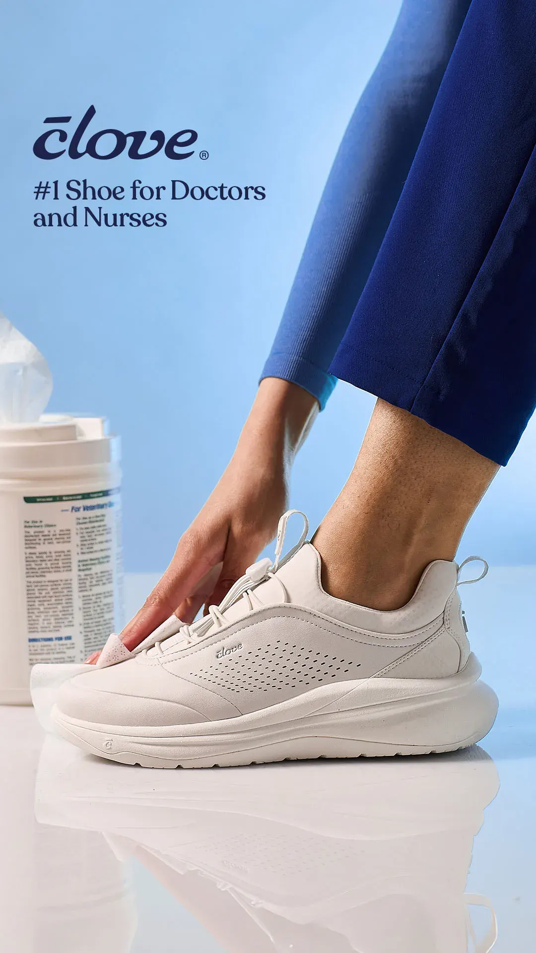 Clove nurse shoe ad example: a hand adjusts a white sneaker on a blue-scrubbed leg beside a disinfectant wipes tub