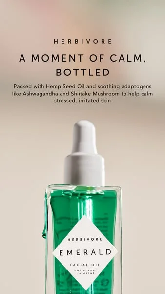 Herbivore Botanicals Emerald Facial Oil on cream background skincare ad